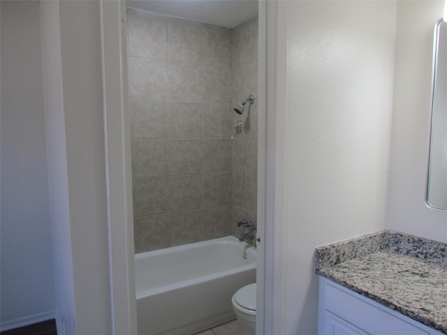 bathroom featuring toilet, tile patterned flooring, bathing tub / shower combination, and vanity