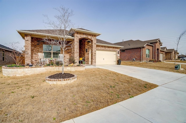 view of front of home featuring driveway, an attached garage, a front lawn, a porch, and brick siding