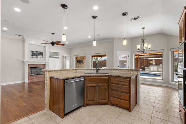 kitchen featuring appliances with stainless steel finishes, plenty of natural light, a sink, and visible vents