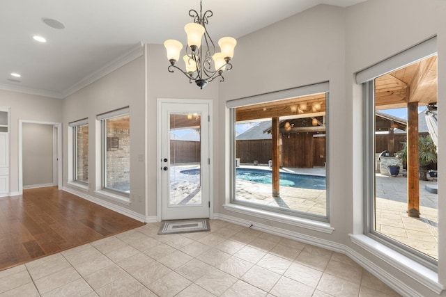 doorway featuring light tile patterned floors, baseboards, crown molding, and recessed lighting