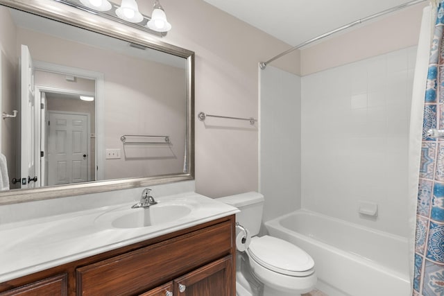 full bathroom featuring shower / tub combo with curtain, vanity, and toilet