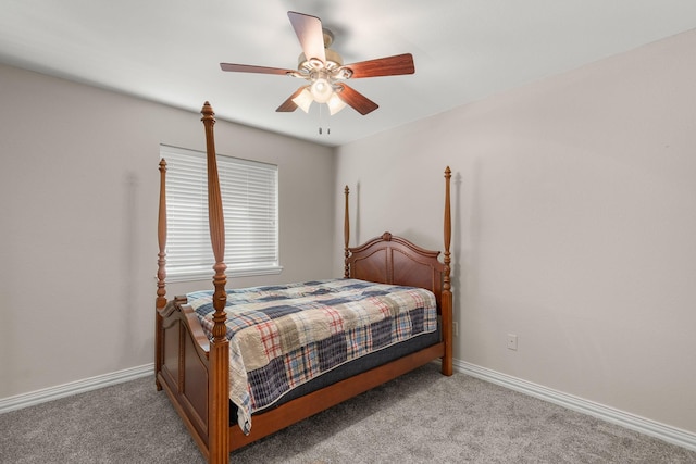 carpeted bedroom with baseboards and a ceiling fan