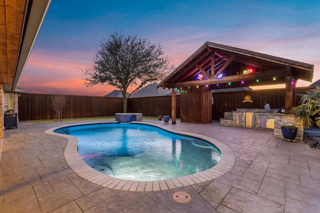 view of swimming pool featuring a patio area, a fenced backyard, a fenced in pool, and area for grilling