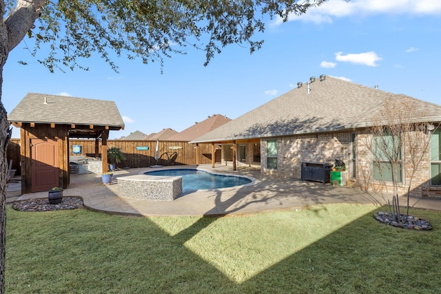 view of swimming pool with a patio area, a fenced backyard, and a lawn