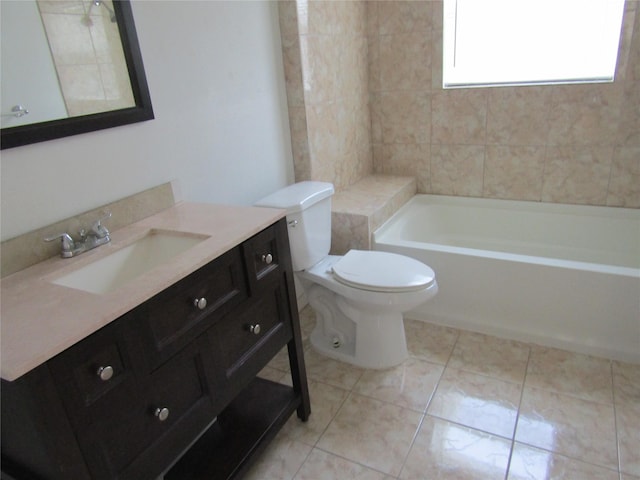 bathroom featuring tile patterned flooring, tub / shower combination, vanity, and toilet