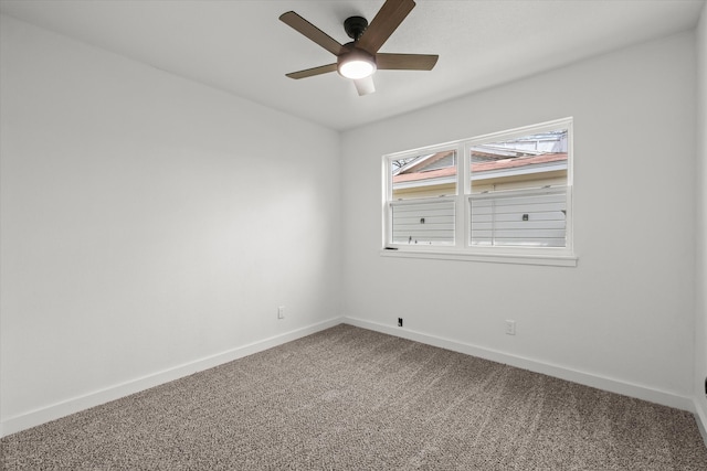 unfurnished room featuring a ceiling fan, baseboards, and carpet floors