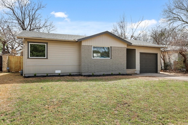 single story home with brick siding, fence, concrete driveway, a front yard, and a garage