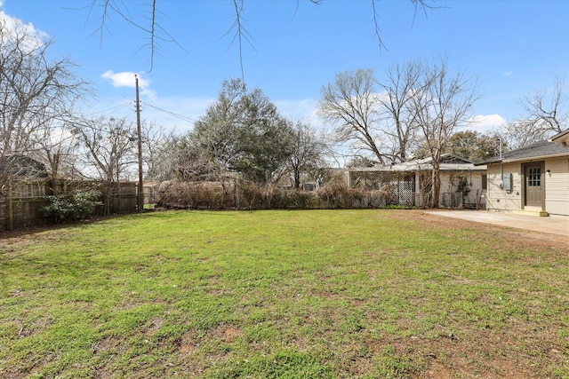 view of yard with a patio and a fenced backyard