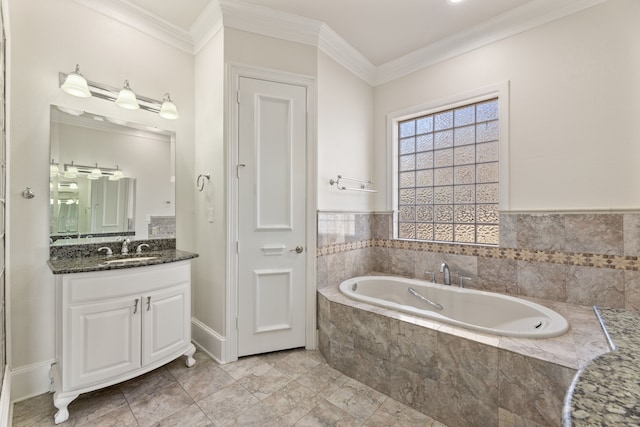 full bathroom with ornamental molding, a garden tub, and vanity