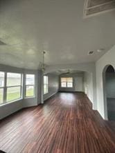 unfurnished living room featuring wood finished floors