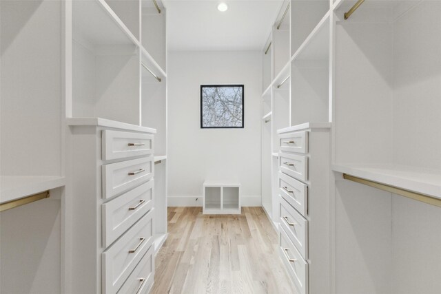 walk in closet with light wood-style flooring and visible vents