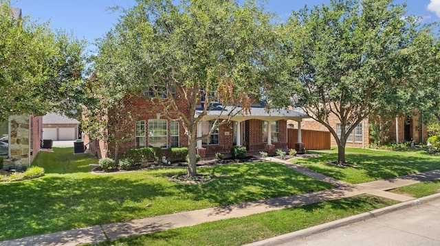 view of front of property featuring a front yard and brick siding