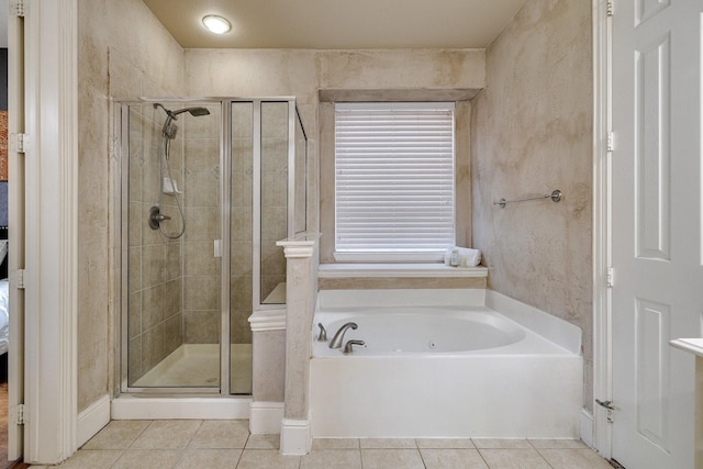 ensuite bathroom featuring a garden tub, a shower stall, connected bathroom, and tile patterned floors