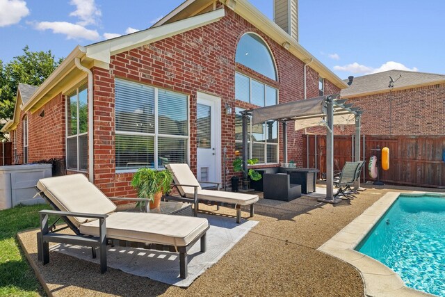 rear view of house with a fenced in pool, brick siding, a patio, a pergola, and a fenced backyard