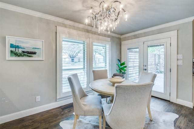 dining space with a wealth of natural light, crown molding, and french doors