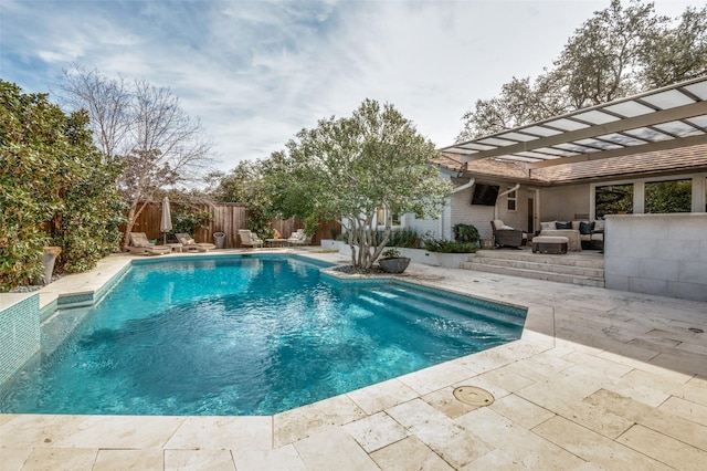 view of pool featuring a patio area, fence, outdoor lounge area, and a fenced in pool