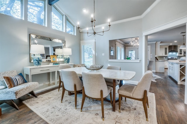 dining room with high vaulted ceiling, a chandelier, dark wood finished floors, and ornamental molding