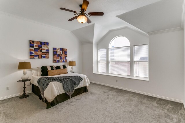 carpeted bedroom with lofted ceiling, a ceiling fan, and baseboards