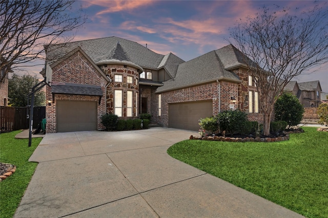 14109 Katiliz Pl, Frisco, TX 75035 - french country style house with brick siding, driveway, an attached garage, and a shingled roof