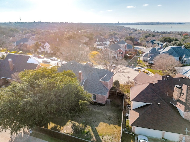 birds eye view of property featuring a water view and a residential view