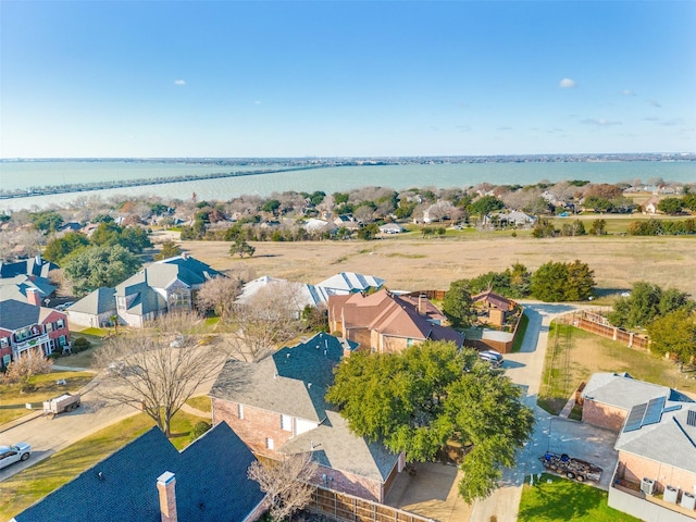 bird's eye view with a water view and a residential view