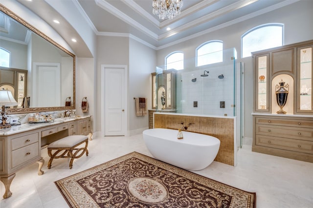 bathroom featuring vanity, a freestanding bath, walk in shower, crown molding, and a chandelier