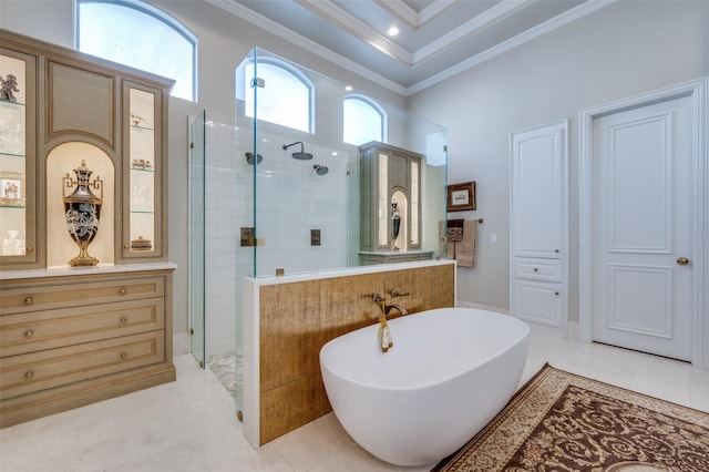 bathroom featuring tile patterned floors, a freestanding bath, walk in shower, and crown molding