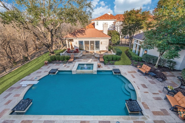 view of pool with a fenced in pool, an exterior structure, fence, an outdoor structure, and an in ground hot tub