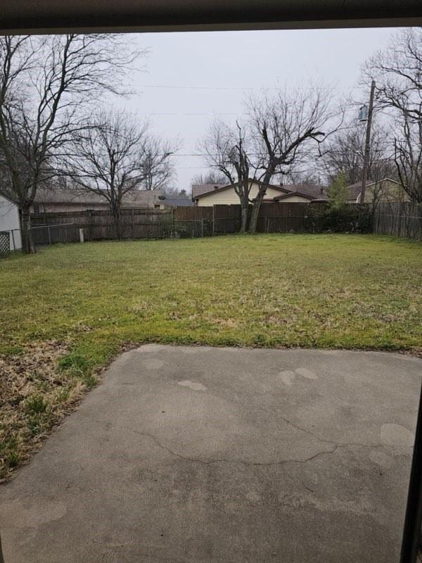 view of yard with a patio area and a fenced backyard