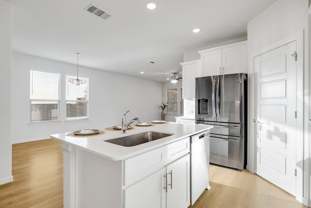 1536 Wolfberry Ln, Northlake, TX 76226 - kitchen with a sink, stainless steel fridge, dishwasher, light wood-style flooring, and recessed lighting