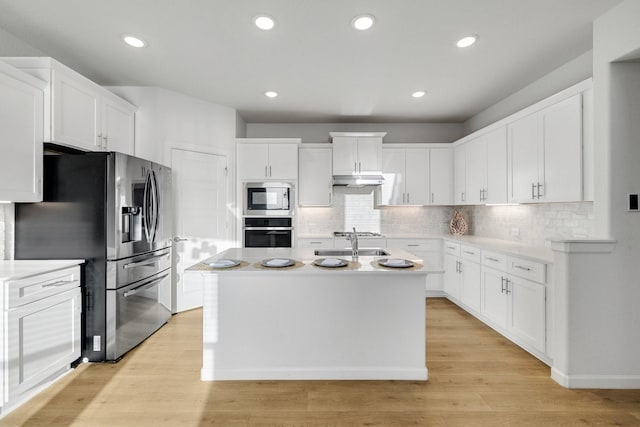 1536 Wolfberry Ln, Northlake, TX 76226 - kitchen with appliances with stainless steel finishes, white cabinetry, a sink, an island with sink, and backsplash