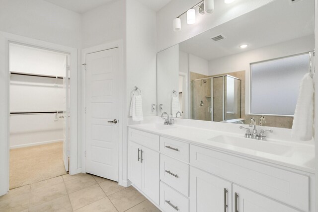 1536 Wolfberry Ln, Northlake, TX 76226 - full bathroom with a stall shower, a walk in closet, tile patterned floors, and double vanity
