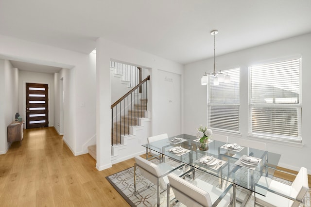1536 Wolfberry Ln, Northlake, TX 76226 - dining area featuring stairway, light wood-style floors, baseboards, and a chandelier