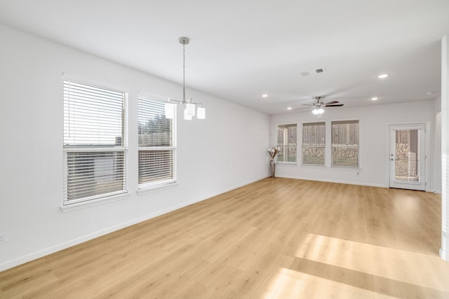 1536 Wolfberry Ln, Northlake, TX 76226 - unfurnished living room featuring recessed lighting, a chandelier, light wood-type flooring, and baseboards