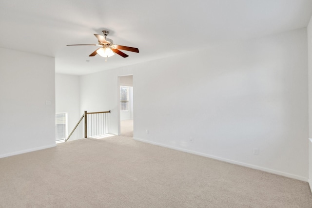 1536 Wolfberry Ln, Northlake, TX 76226 - empty room with light colored carpet, a ceiling fan, and baseboards
