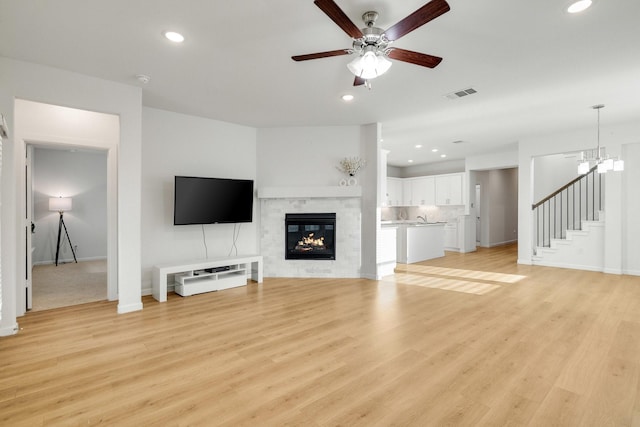 1536 Wolfberry Ln, Northlake, TX 76226 - unfurnished living room with stairway, recessed lighting, a ceiling fan, baseboards, and light wood-style flooring