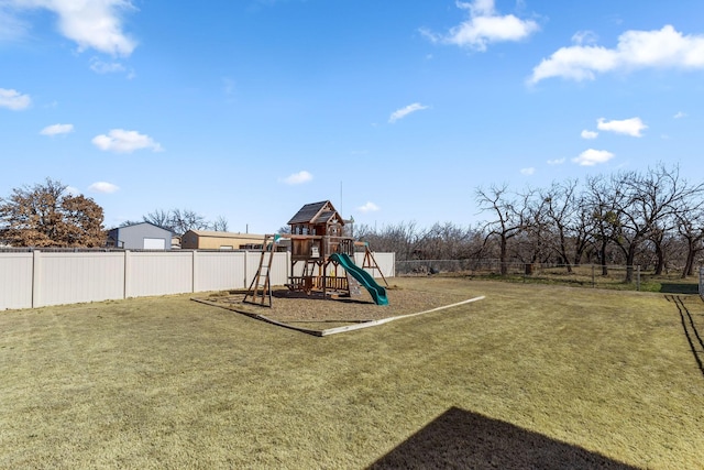 view of playground with fence and a lawn