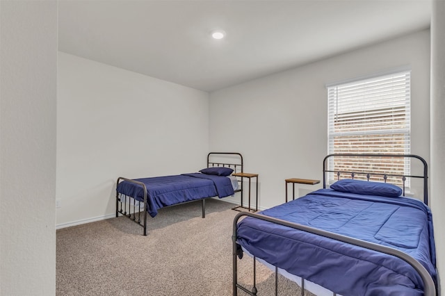 carpeted bedroom with baseboards