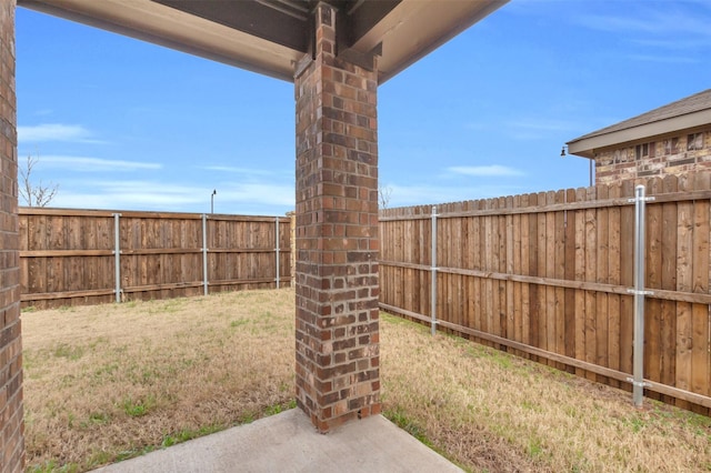 view of yard with a fenced backyard