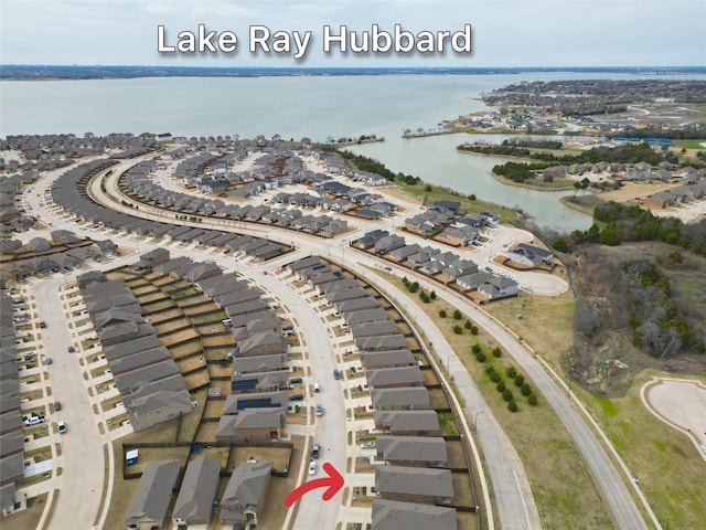 bird's eye view with a residential view and a water view