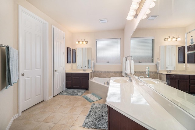 1202 Newcastle St, Roanoke, TX 76262 - full bath featuring a garden tub, tile patterned floors, and two vanities