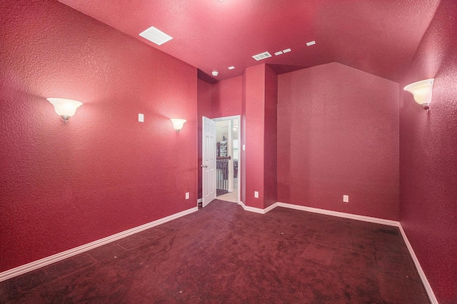 1202 Newcastle St, Roanoke, TX 76262 - home theater with a textured wall, lofted ceiling, carpet flooring, baseboards, and a textured ceiling