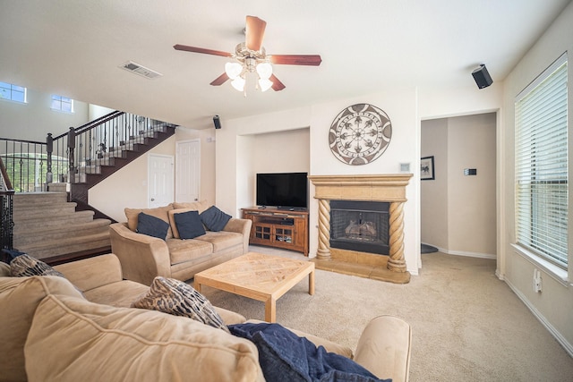 1202 Newcastle St, Roanoke, TX 76262 - carpeted living room with ceiling fan, stairway, a fireplace with raised hearth, and baseboards