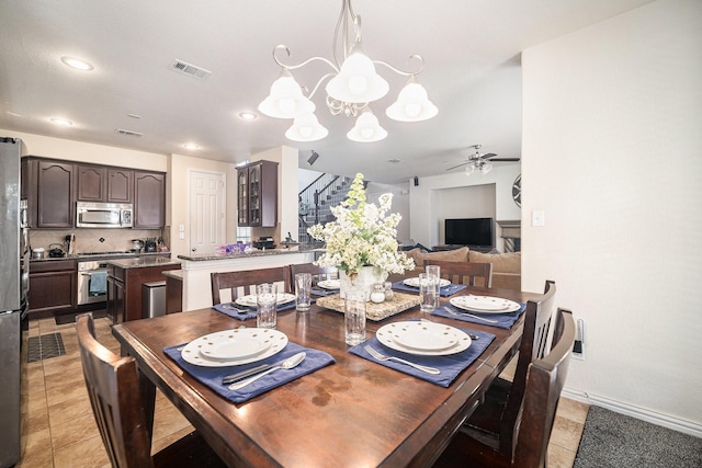 1202 Newcastle St, Roanoke, TX 76262 - dining room with stairs, ceiling fan, a chandelier, baseboards, and light tile patterned floors