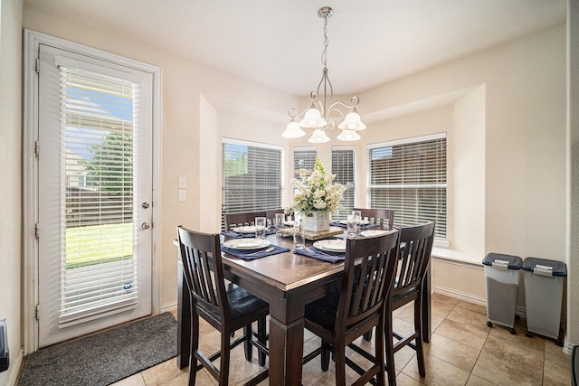 1202 Newcastle St, Roanoke, TX 76262 - dining room with a chandelier, light tile patterned flooring, and baseboards