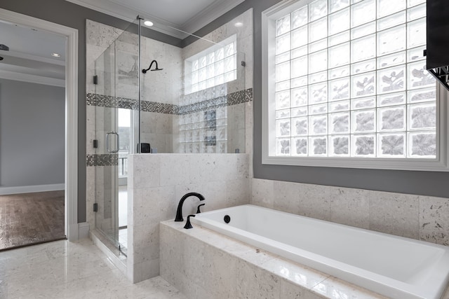 bathroom with ornamental molding, a stall shower, and a garden tub