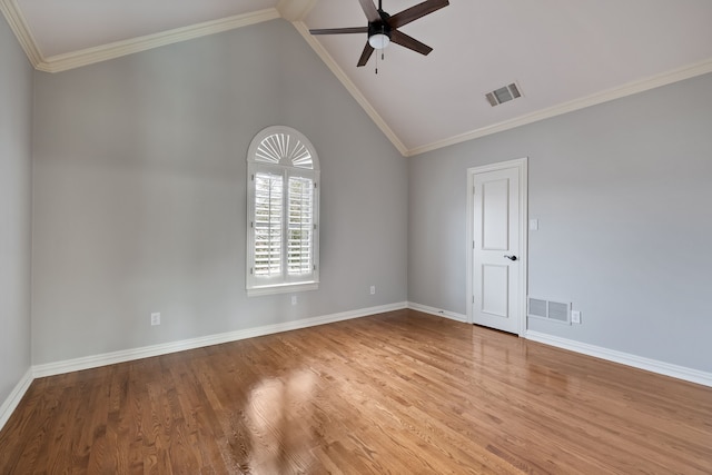 spare room with baseboards, wood finished floors, visible vents, and a ceiling fan