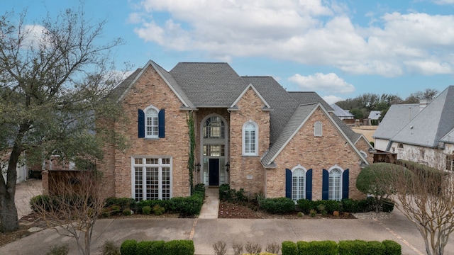 traditional-style house with brick siding