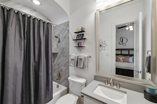 full bathroom featuring shower / bath combo, a ceiling fan, toilet, ensuite bath, and vanity