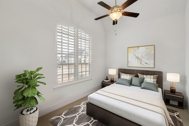 bedroom featuring lofted ceiling, ceiling fan, carpet flooring, and baseboards